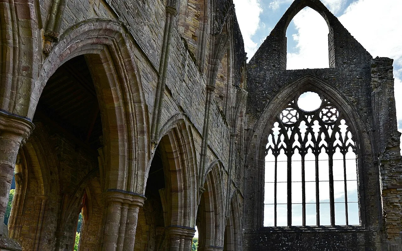 The great traceried window of Tintern Abbey seen from inside